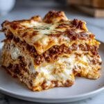 A thick, cheesy slice of easy lasagna with ricotta, layered with meat sauce and melted mozzarella.