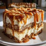 Close-up of a rich slice of no-bake gingerbread trifle layered with cream and drizzled with caramel sauce.